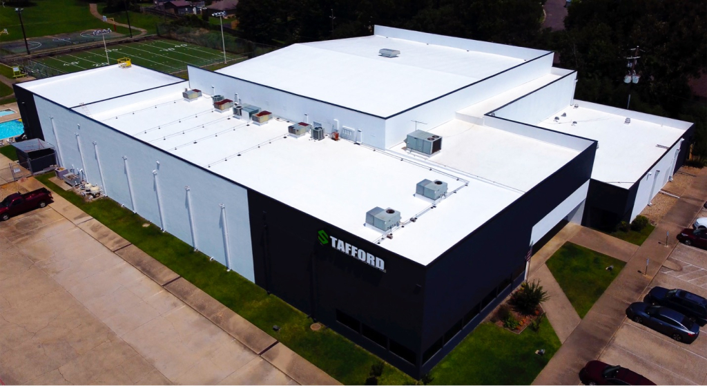 Aerial drone photo of a flat, white commercial roof